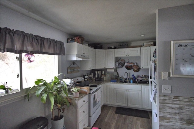 kitchen featuring dark hardwood / wood-style flooring, sink, white cabinets, and white electric range