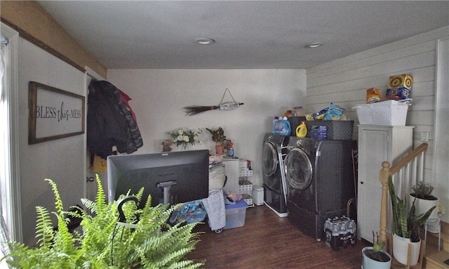 laundry area featuring washing machine and clothes dryer and dark hardwood / wood-style floors