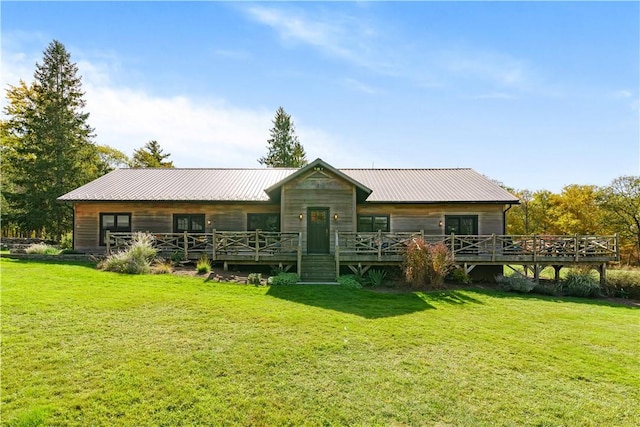 back of house with a yard and a wooden deck