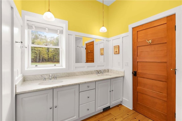 bathroom featuring vanity and hardwood / wood-style flooring