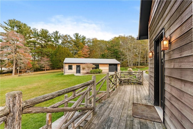 wooden deck with an outbuilding and a lawn