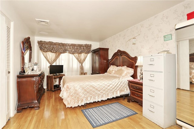 bedroom with light wood-type flooring