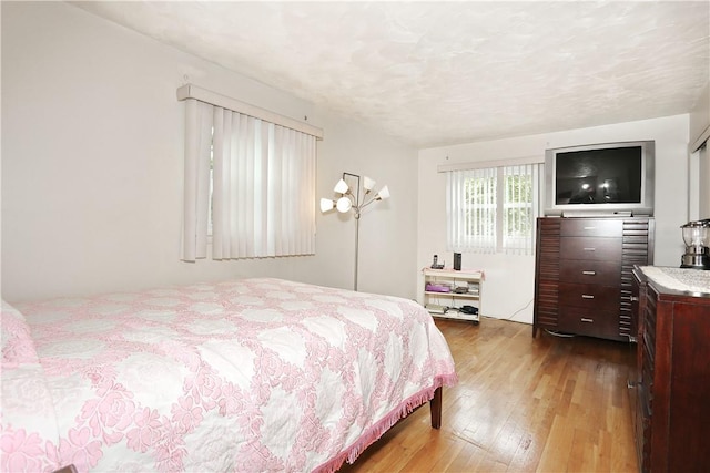 bedroom featuring hardwood / wood-style flooring