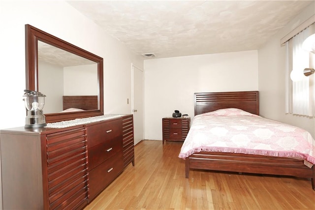 bedroom featuring light hardwood / wood-style floors