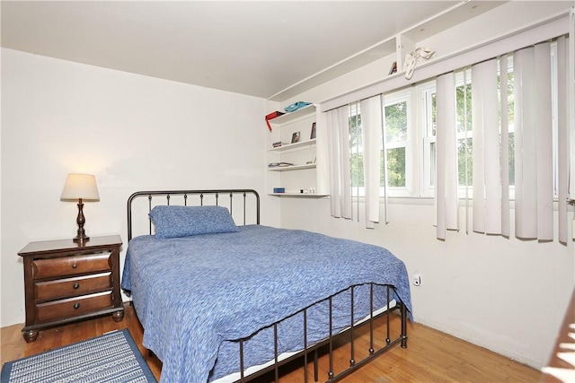 bedroom featuring hardwood / wood-style flooring