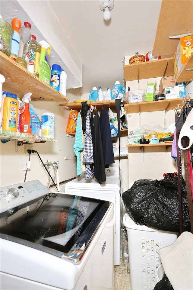 laundry area featuring washing machine and clothes dryer