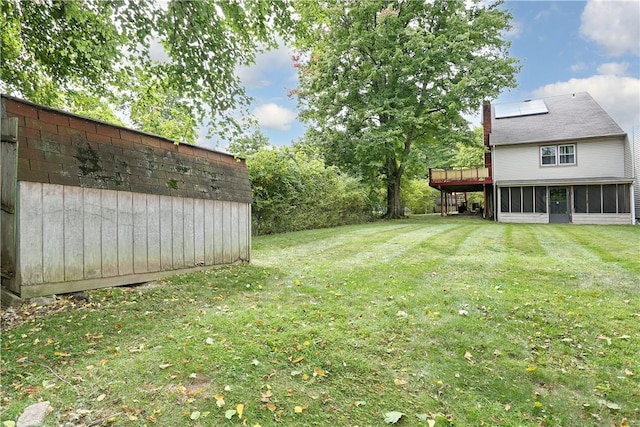 view of yard with a storage shed and a wooden deck