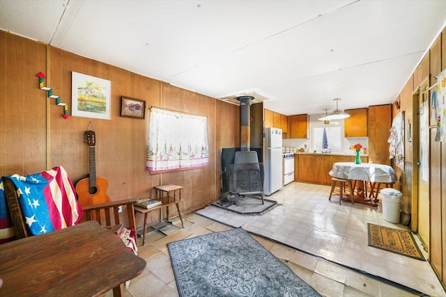 interior space featuring wood walls and a wood stove