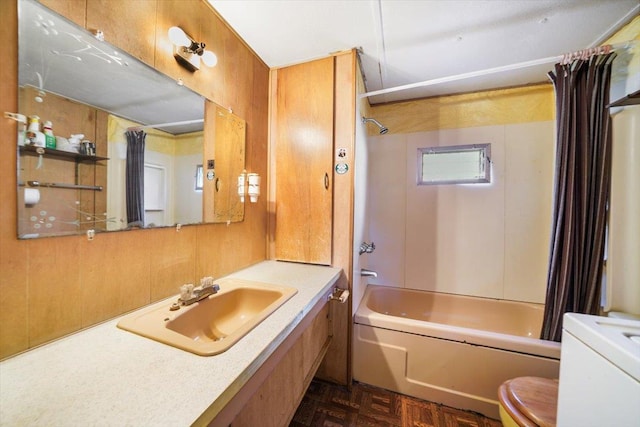 full bathroom with toilet, parquet floors, sink, and shower / tub combo with curtain