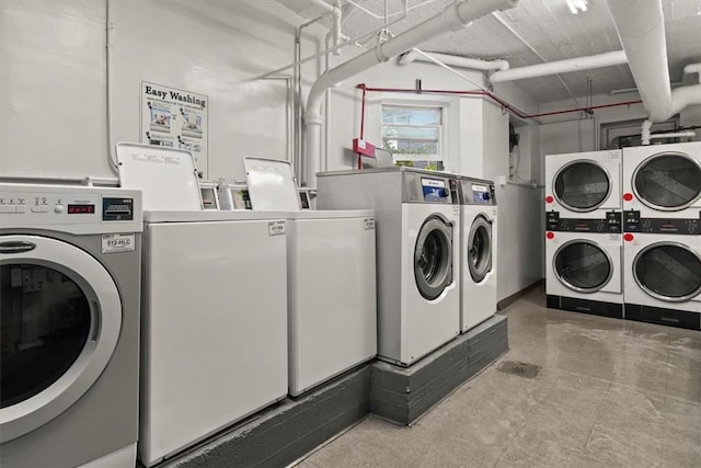 laundry room with washing machine and clothes dryer and stacked washer and dryer