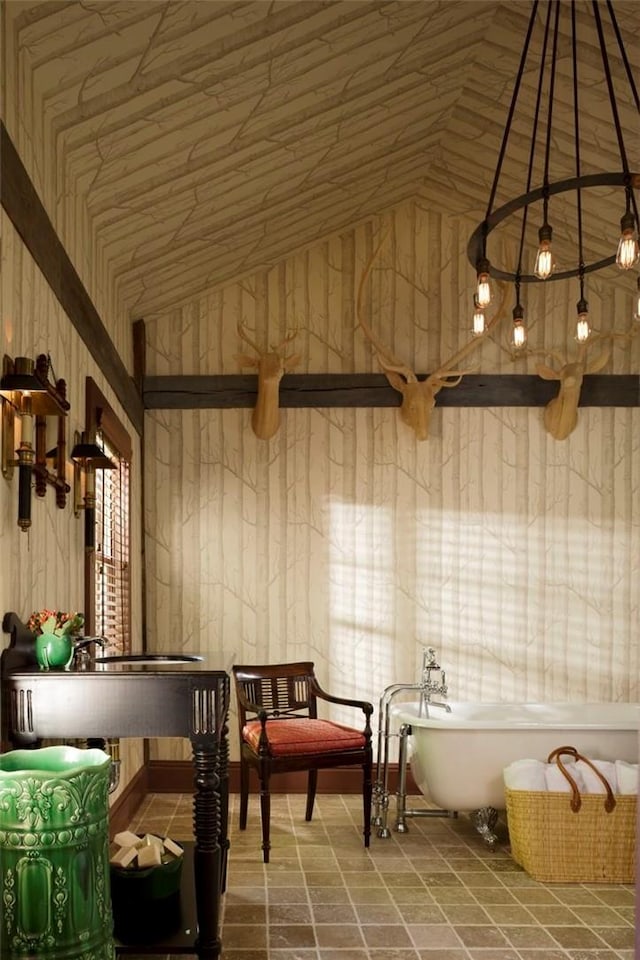 kitchen with decorative light fixtures and lofted ceiling