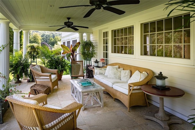 sunroom featuring ceiling fan, wooden ceiling, and decorative columns