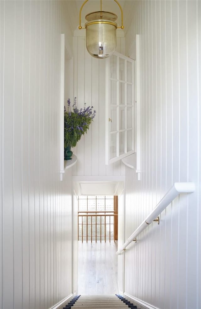 stairs with wood-type flooring