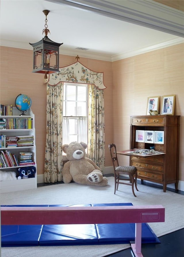 sitting room featuring carpet and crown molding