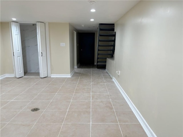 hallway featuring light tile patterned flooring