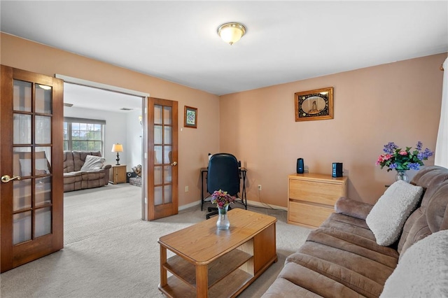 living room with light carpet and french doors