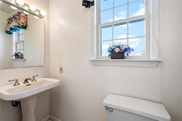 bathroom featuring toilet and sink