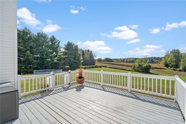 wooden deck with a lawn