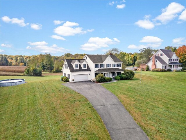 view of front facade with a garage and a front yard