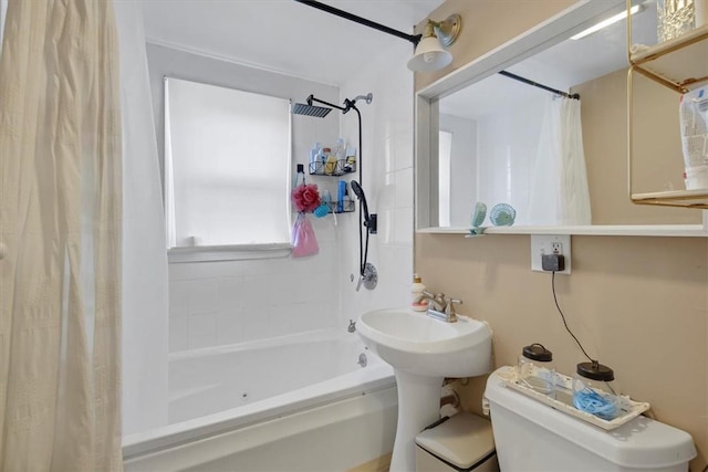 bathroom with shower / bath combination with curtain and toilet