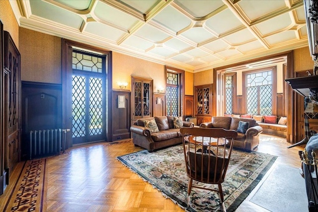 living room with light parquet flooring and crown molding