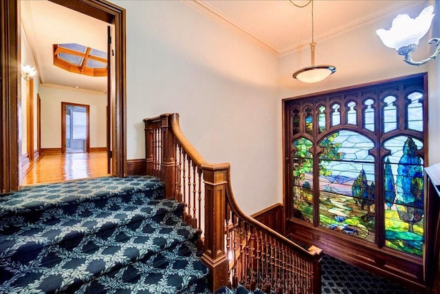 entryway featuring ornamental molding and wood walls