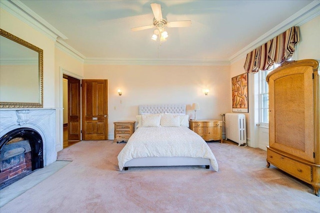 carpeted bedroom featuring radiator heating unit, ceiling fan, and ornamental molding