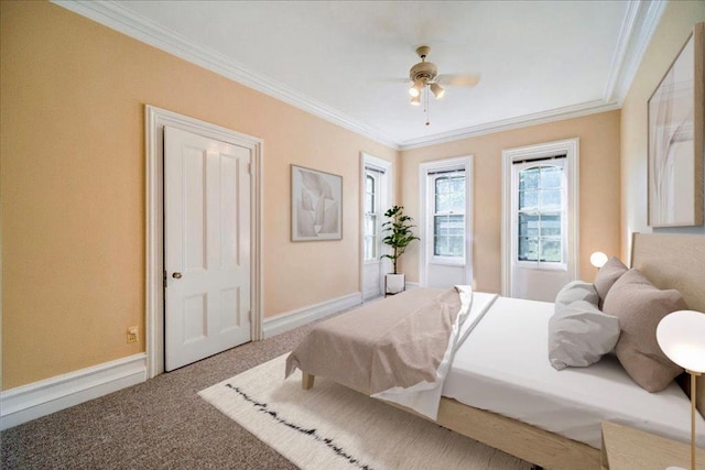 bedroom with carpet, ceiling fan, and ornamental molding