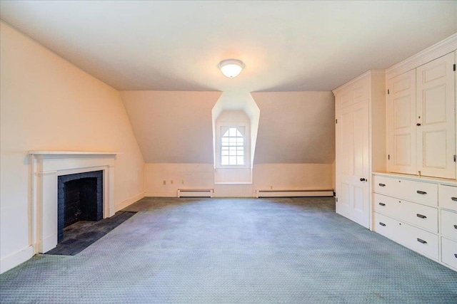 bonus room with dark carpet, a baseboard radiator, and vaulted ceiling