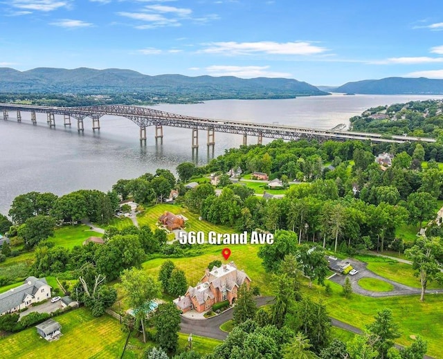 aerial view featuring a water and mountain view