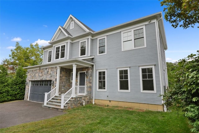 view of front facade featuring a front yard and a garage