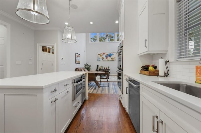 kitchen featuring white cabinets and a wealth of natural light