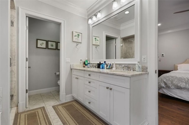 bathroom featuring vanity, crown molding, ceiling fan, toilet, and wood-type flooring