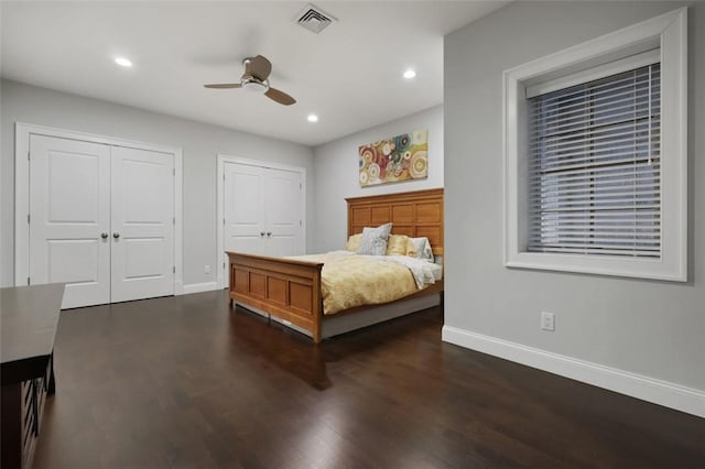 bedroom with ceiling fan and dark hardwood / wood-style flooring