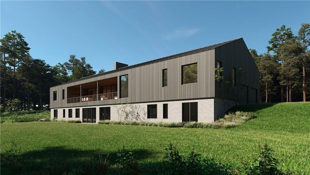 rear view of property featuring a lawn and a balcony