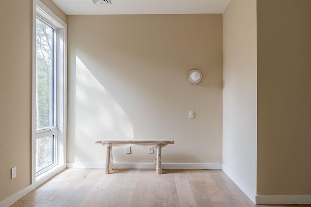 laundry room with light wood-type flooring