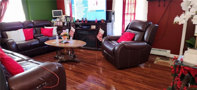 living room with dark wood-type flooring and a baseboard radiator