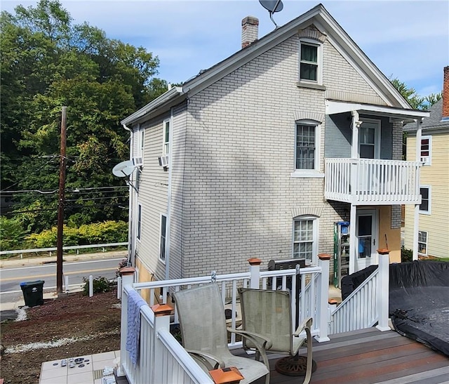 view of home's exterior featuring a balcony