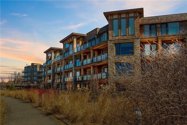 view of outdoor building at dusk