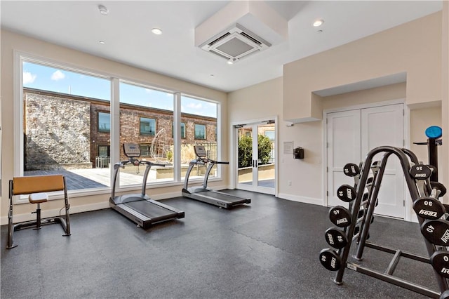 workout area with french doors and a wall mounted AC