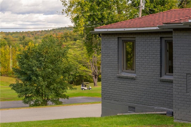 view of home's exterior with a yard