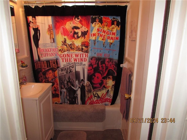 bathroom featuring vanity and shower / tub combo with curtain