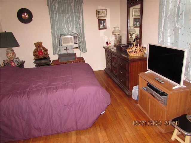 bedroom featuring hardwood / wood-style flooring