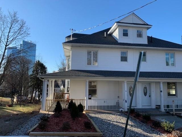 farmhouse inspired home with a porch