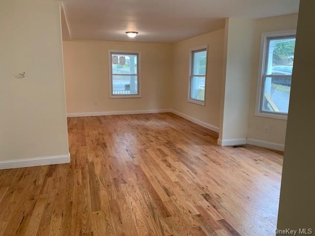 spare room featuring light hardwood / wood-style flooring