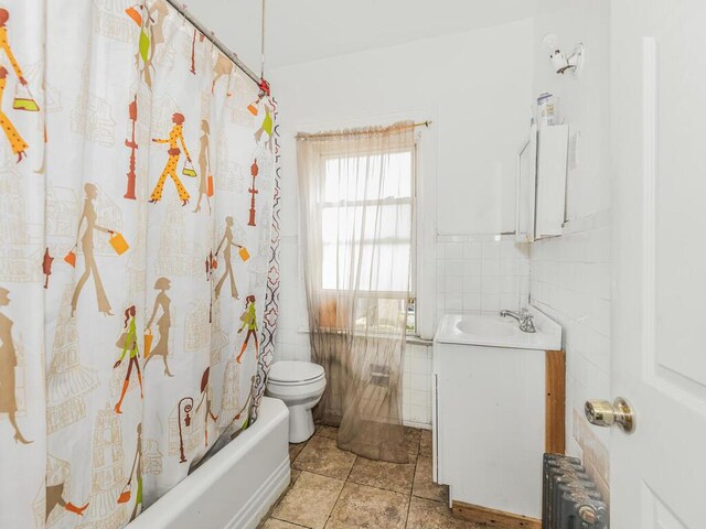 350 S 2nd Ave, Mount Vernon, NY 10550 - full bathroom with radiator, vanity, tile walls, shower / tub combo, and toilet