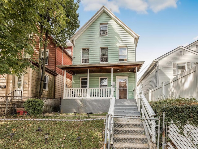 350 S 2nd Ave, Mount Vernon, NY 10550 - view of front of house with covered porch, a gate, stairs, and a fenced front yard
