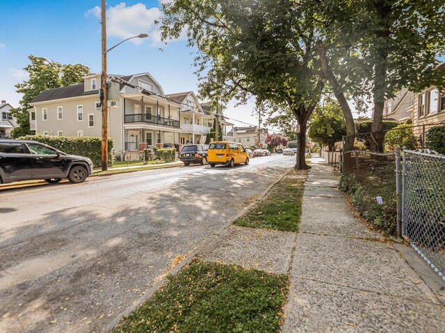 350 S 2nd Ave, Mount Vernon, NY 10550 - view of asphalt street featuring sidewalks, a residential view, street lighting, and curbs