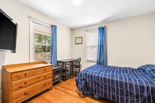 bedroom with hardwood / wood-style flooring