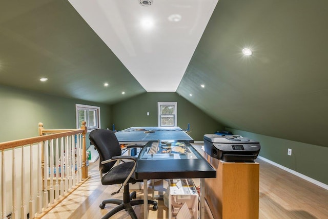 office featuring a wealth of natural light, vaulted ceiling, and light wood-type flooring